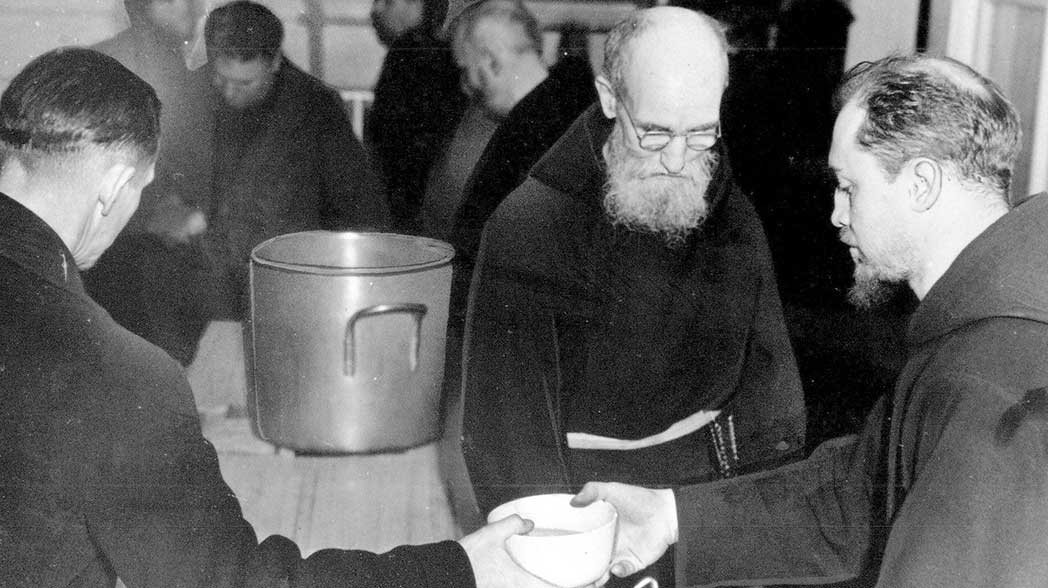 Father Solanus serving at the Capuchin Soup Kitchen.