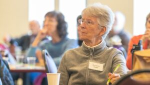 Photograph of an attendee listening during the 2023 Lenten Day of Reflection at the Solanus Casey Center