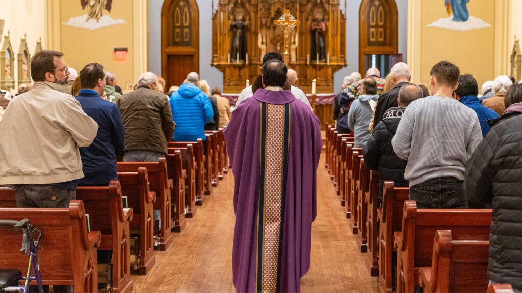 Fr. Ben leads the procession during Mass.