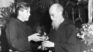 Father Solanus receives a gift of a new ciborium on the occasion of his religious jubilee.