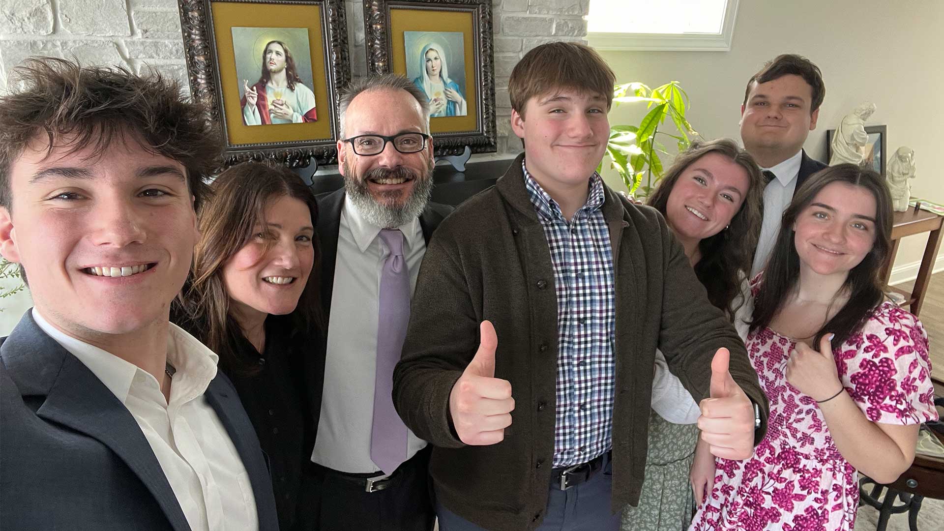 Steven and his family pose for a photo.
