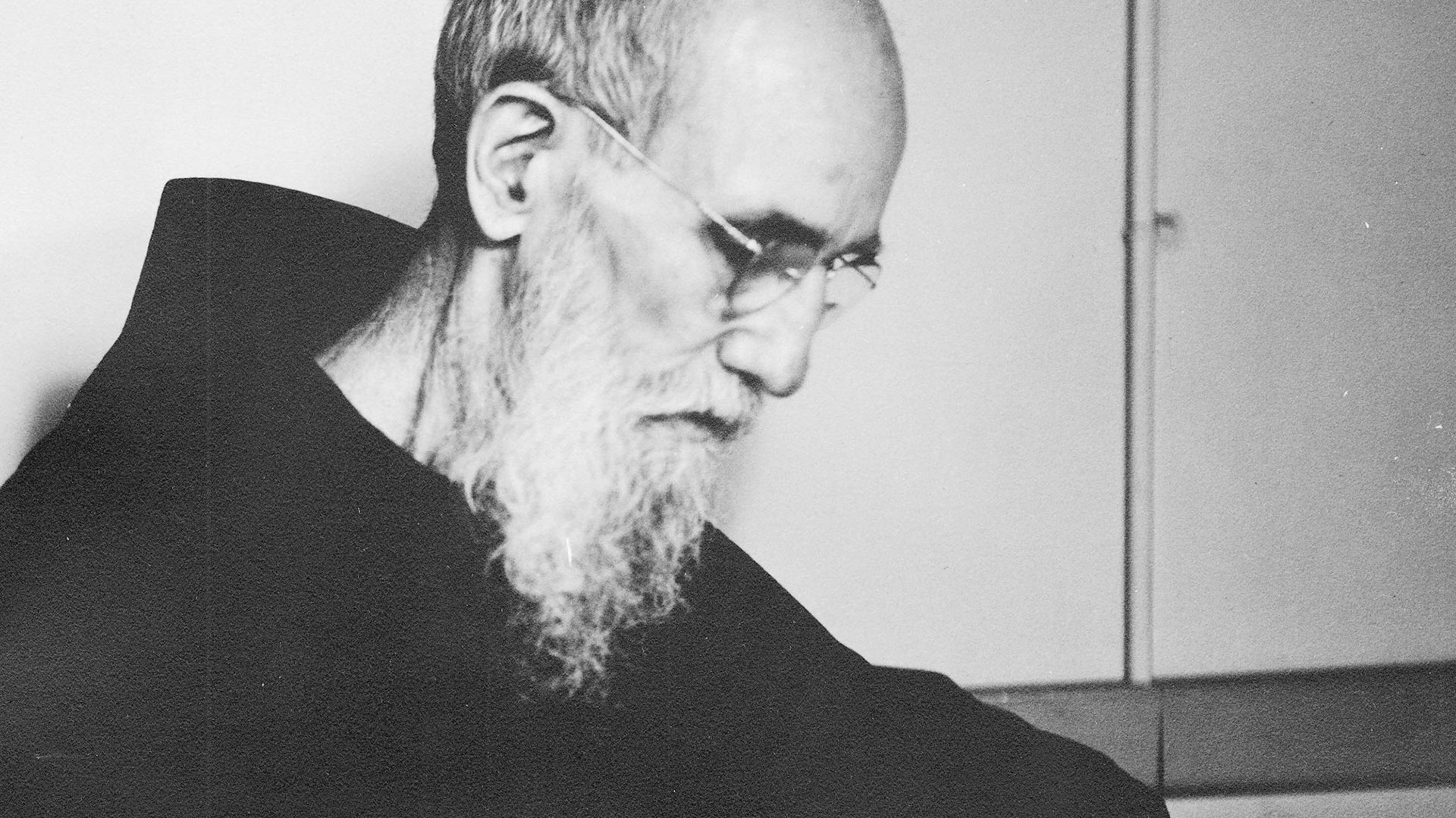 Close-up photo of Blessed Solanus Casey in profile looking down.